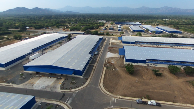 Clinton Foundation industrial park in Haiti is supported by South Korean business interests with ties to the Clinton Foundation. The park failed to provide some additional 55,000 jobs as promised. Workers apparently receive low wages (Image Credit: Miami Herald).