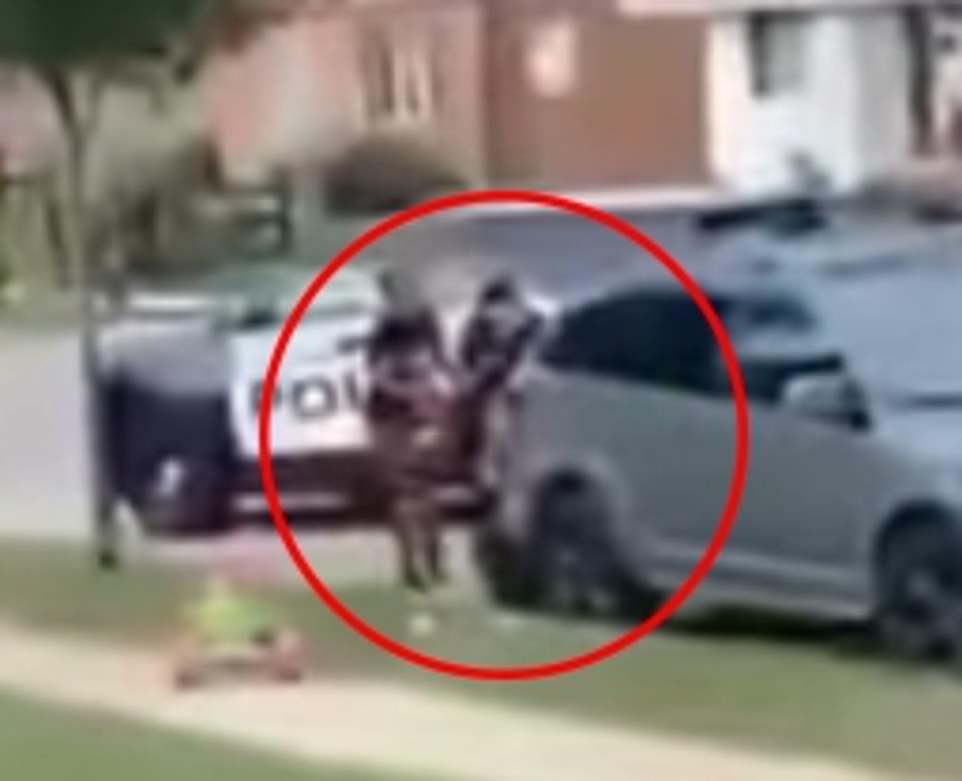 2nd Cell video – Blake wrestling with two officers beside the SUV prior to the shooting (DM)